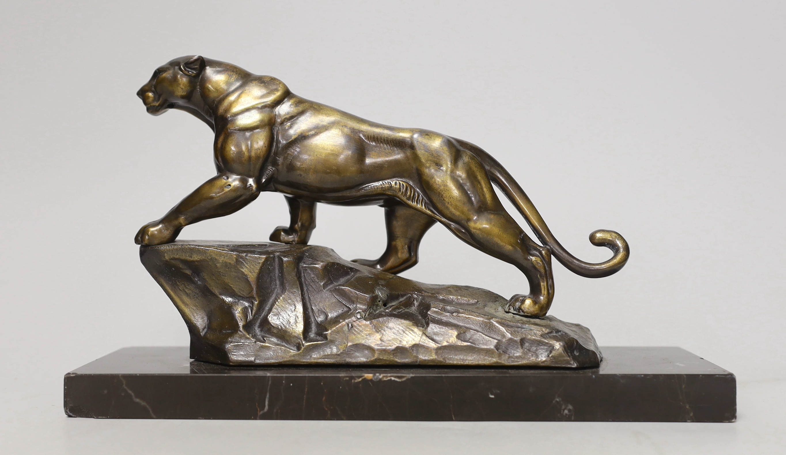 A French Art Deco spelter model of a panther, on marble base, 28cm long